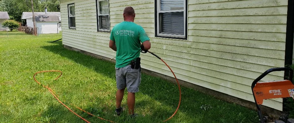 Crew applying insect control treatments on a lawn in Delaware, OH.