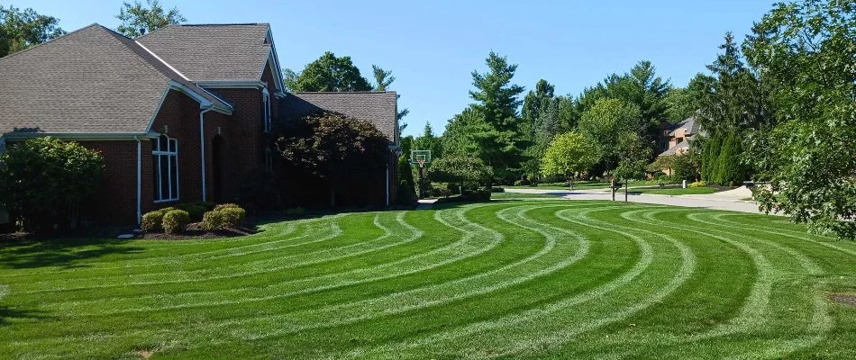 A green lawn with mowing patterns on a property in Hilliard, OH.